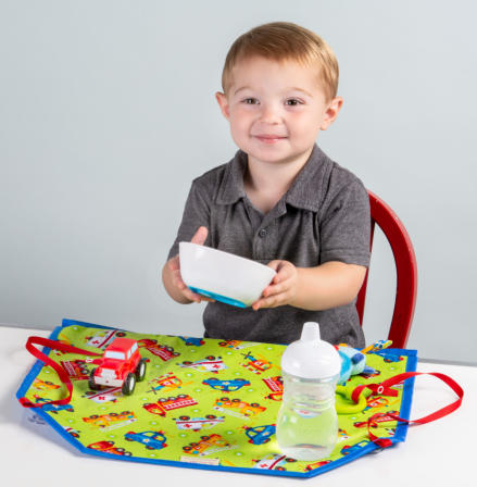 Toddler with lunch time mat