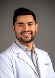 Dentist Headshot with Gray Background