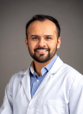 Dentist Headshot with Gray Background